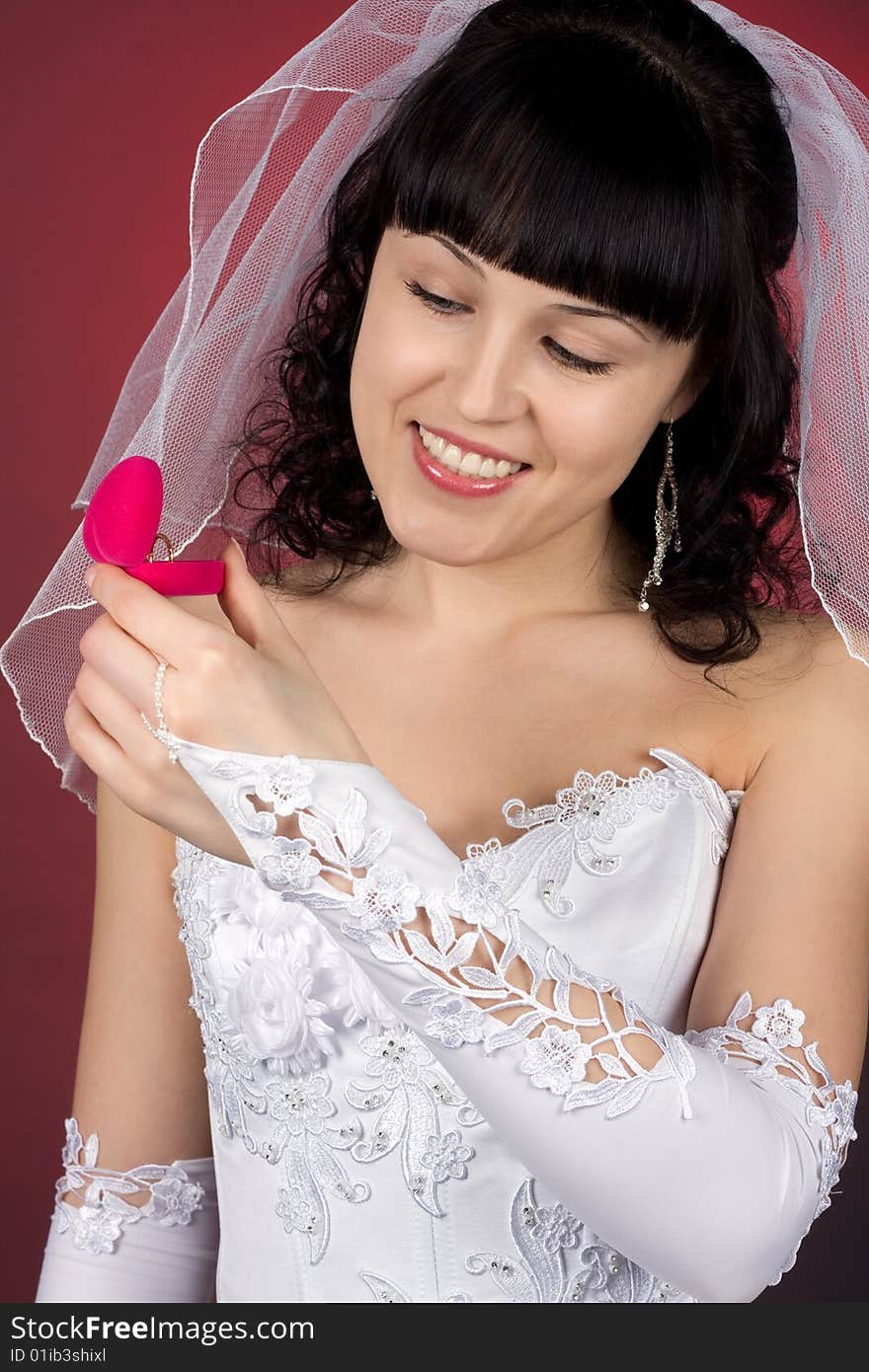 Beautiful  Bride Looking At Wedding Ring