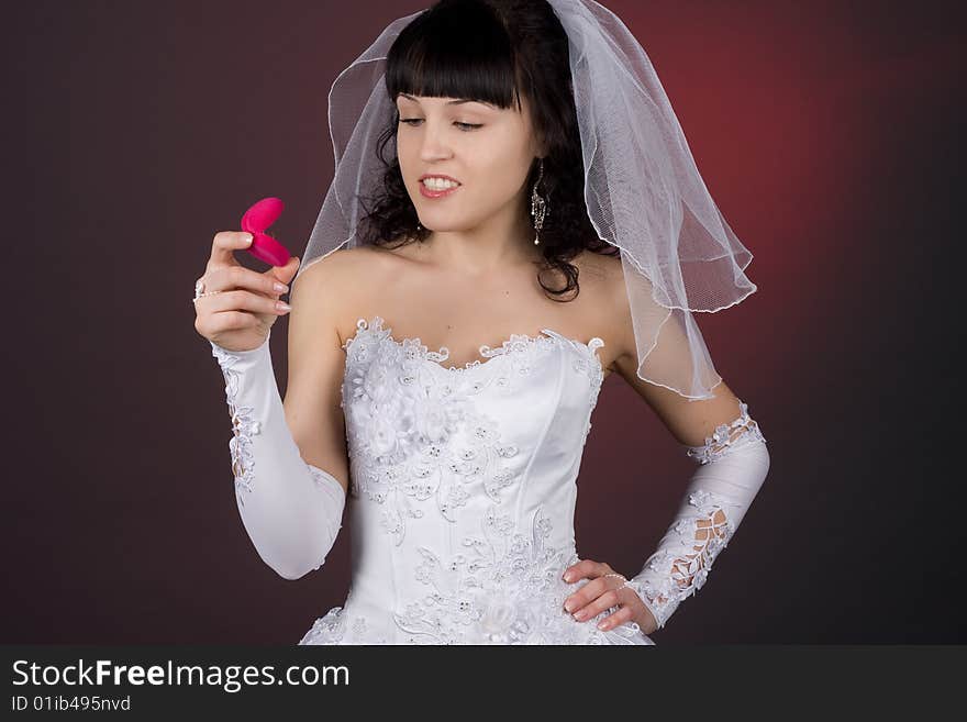 Beautiful bride looking at wedding ring