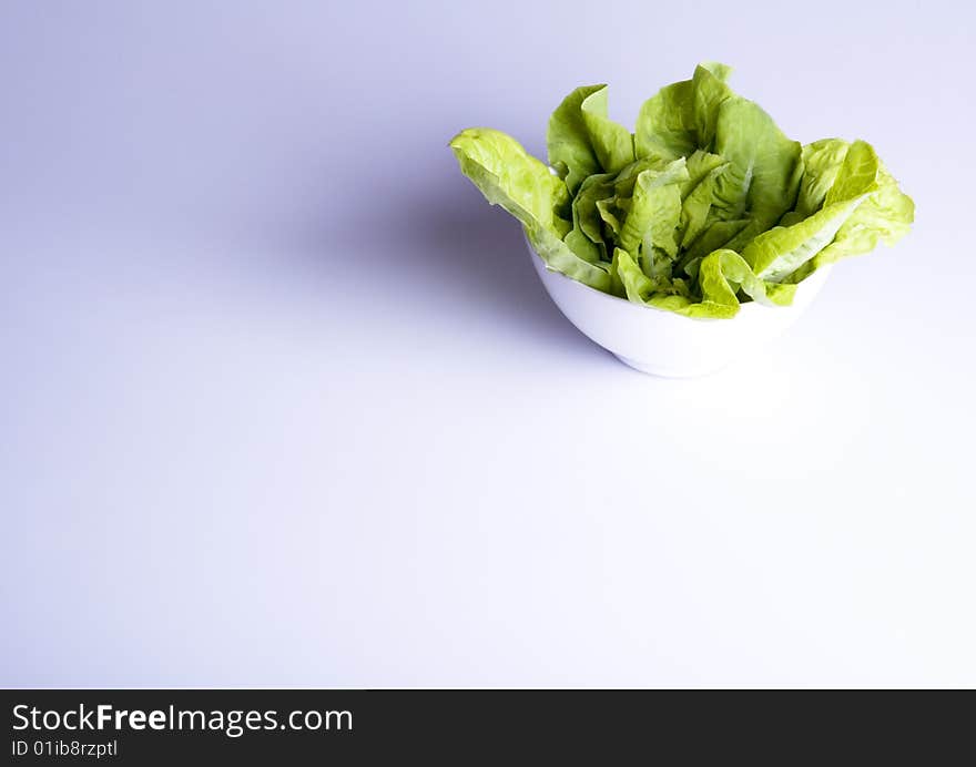 Green salad in white bowl