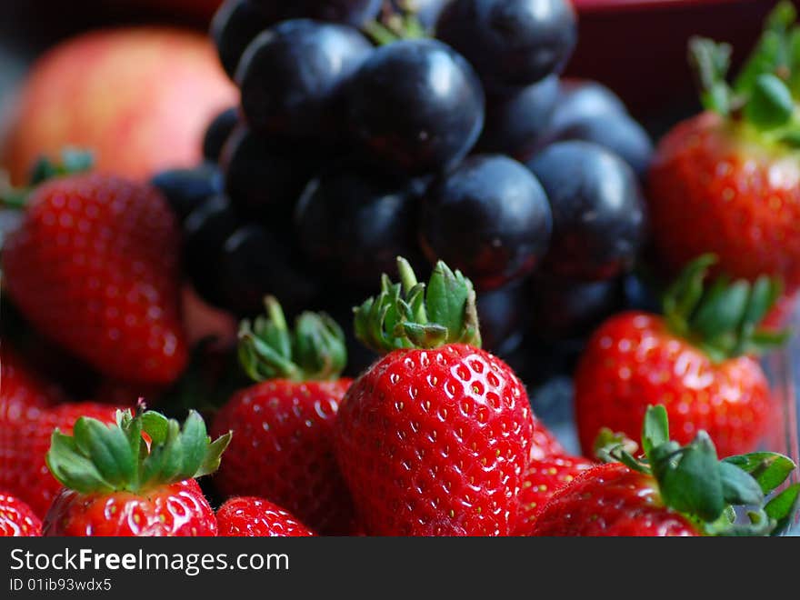 Close up of strawberry and some other fruits as a background.