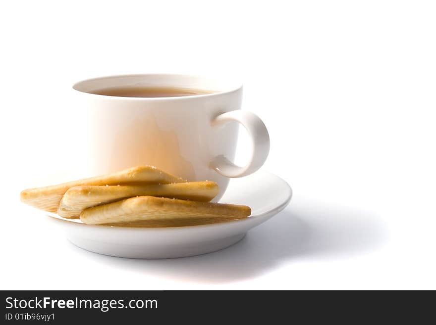 Cup of tea and some cookies on white background