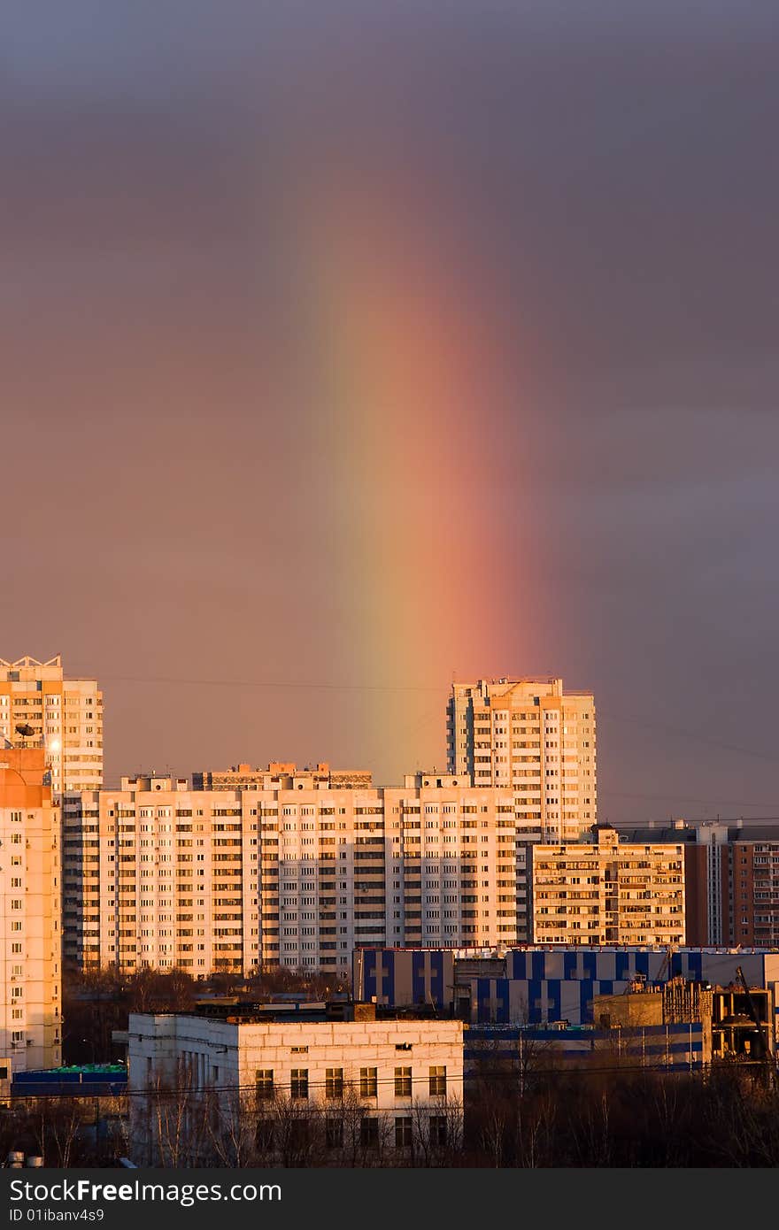 Big rainbow above city buildings. Big rainbow above city buildings