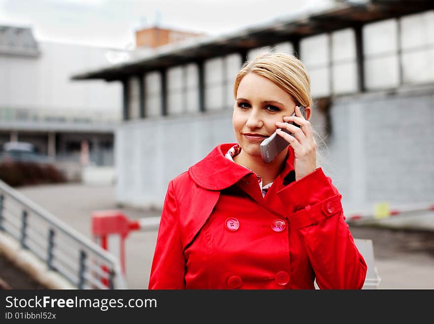 Young blonde woman and her cell phone. Young blonde woman and her cell phone