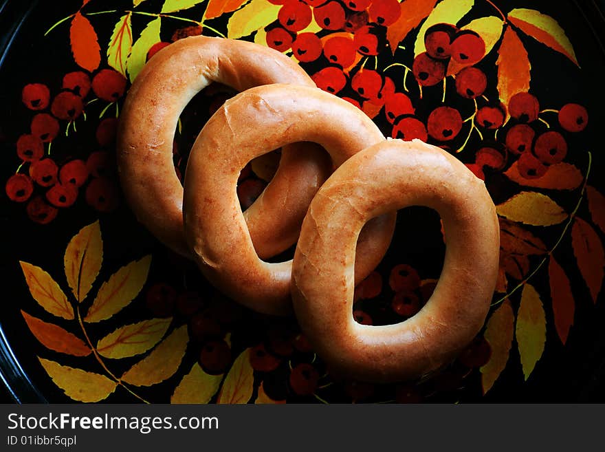 Bagels on tray with mountain ash pattern