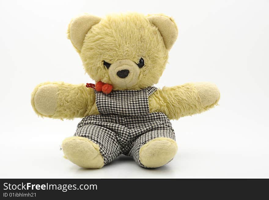 Yellow teddy bear against white background