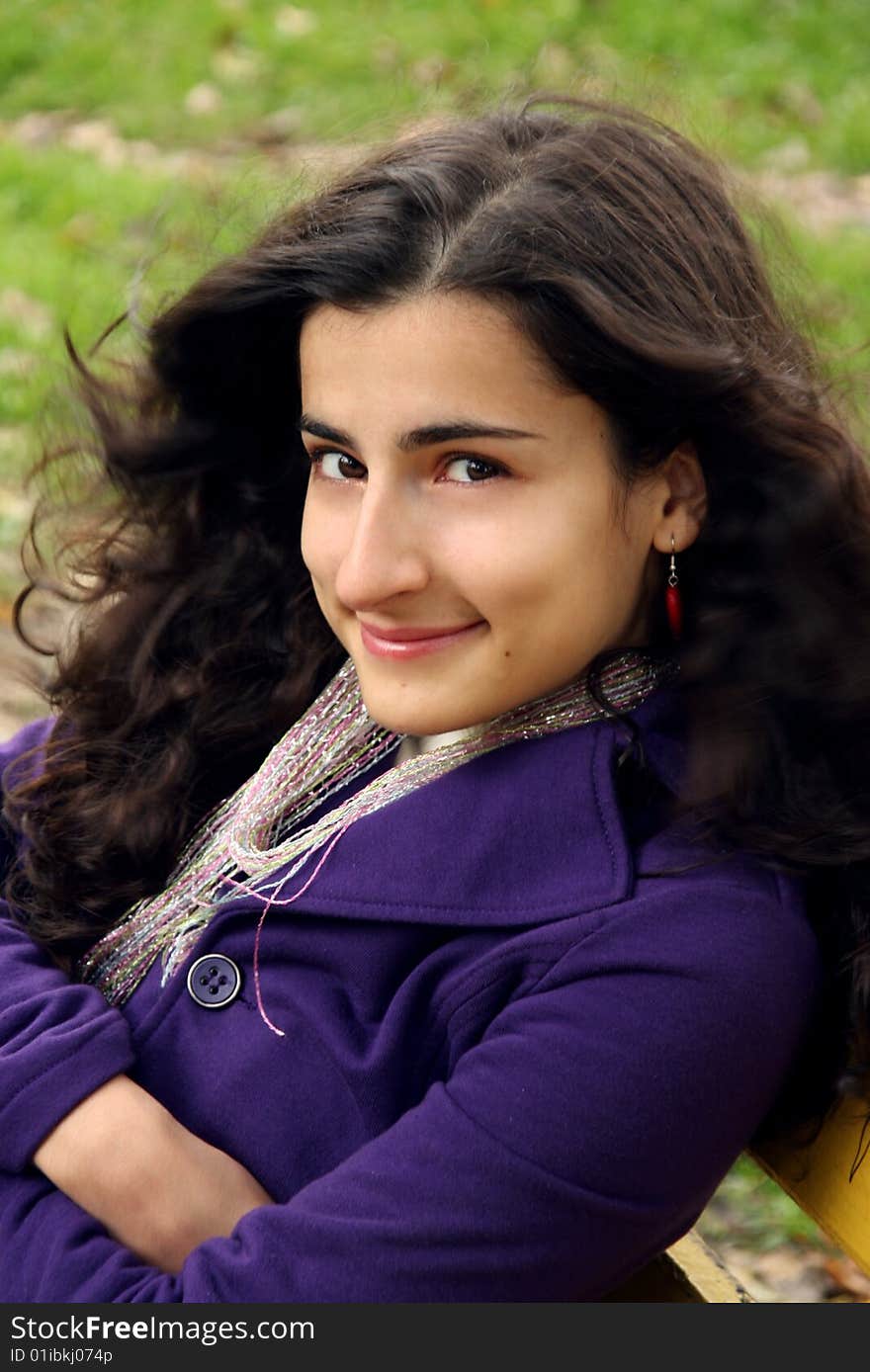 A caucasian girl smiling with waving hair with the wind. A caucasian girl smiling with waving hair with the wind