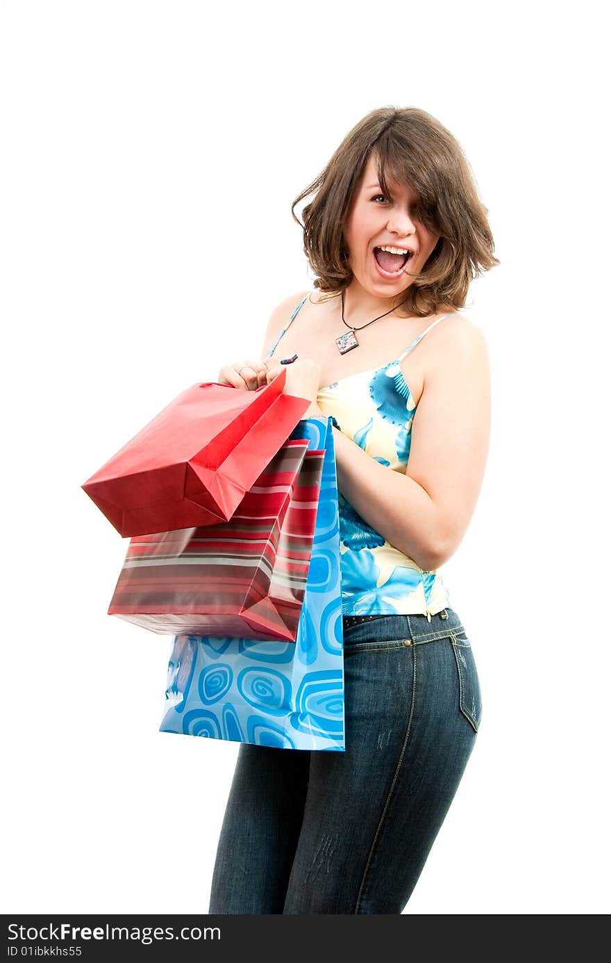 Cute girl after successful shopping with bags in her hands.