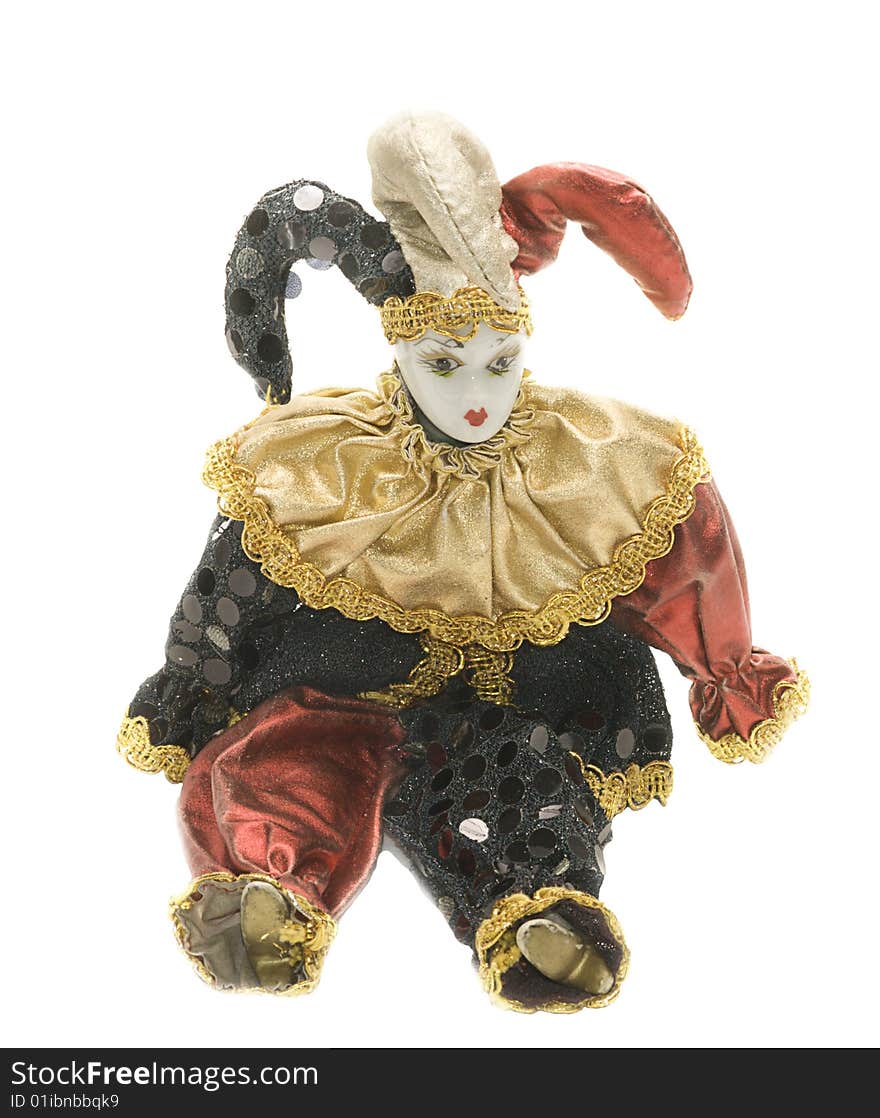 Traditional harlequin doll in jester's outfit