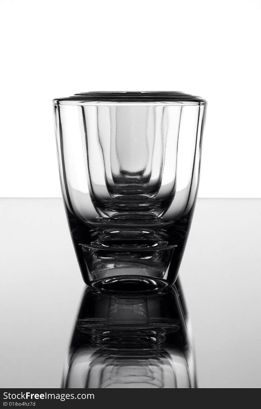 Set of the liquor-glasses on glass surface