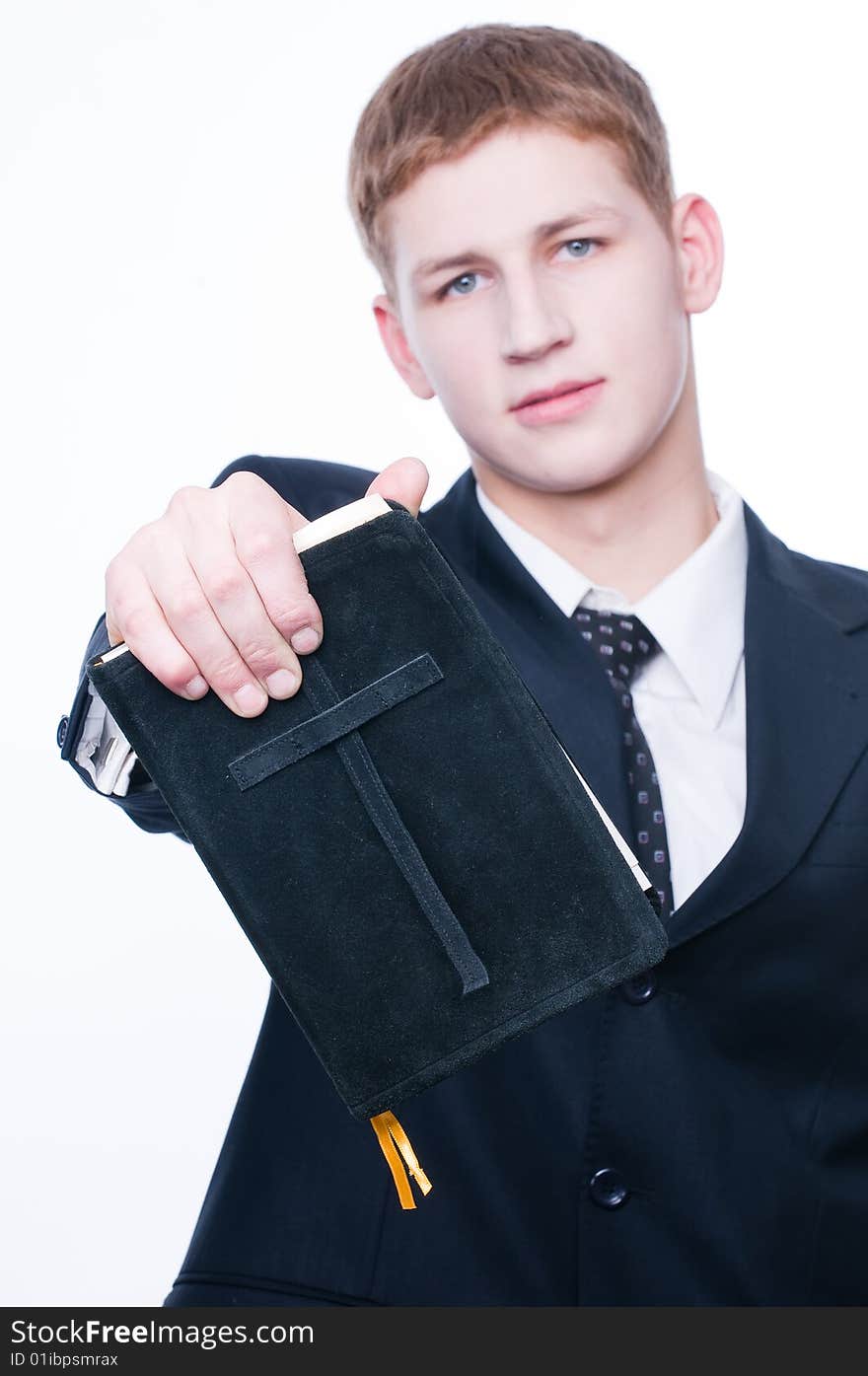 Young man showing Bible, selective focus