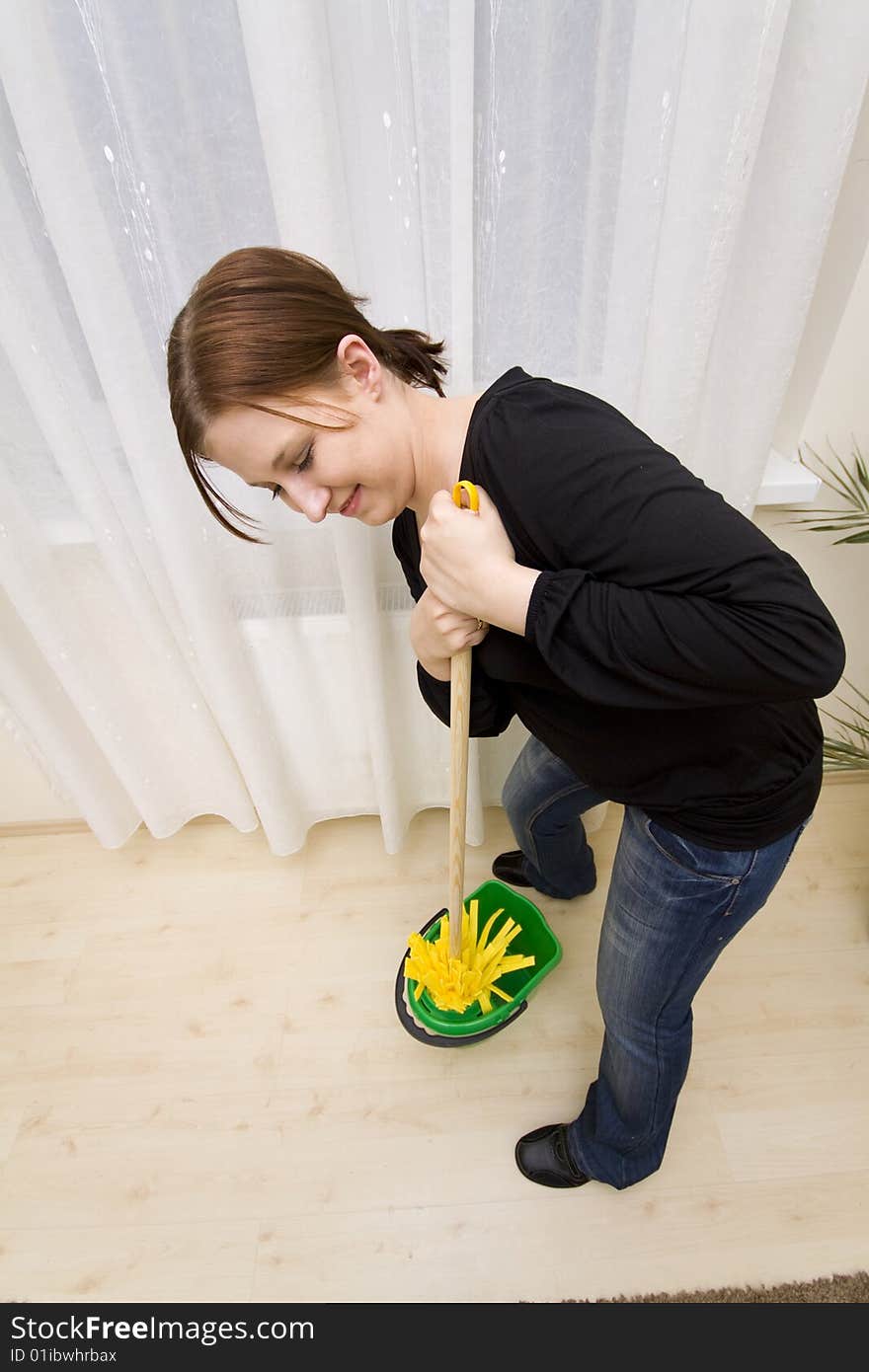 Woman cleaning house in gloves. Woman cleaning house in gloves