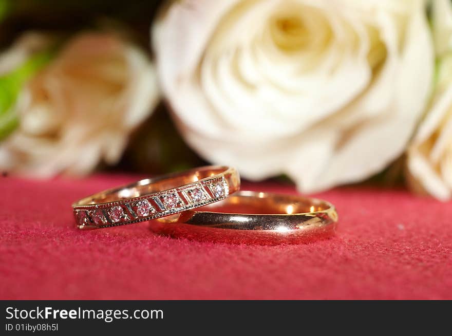 Wedding rings on red cloth