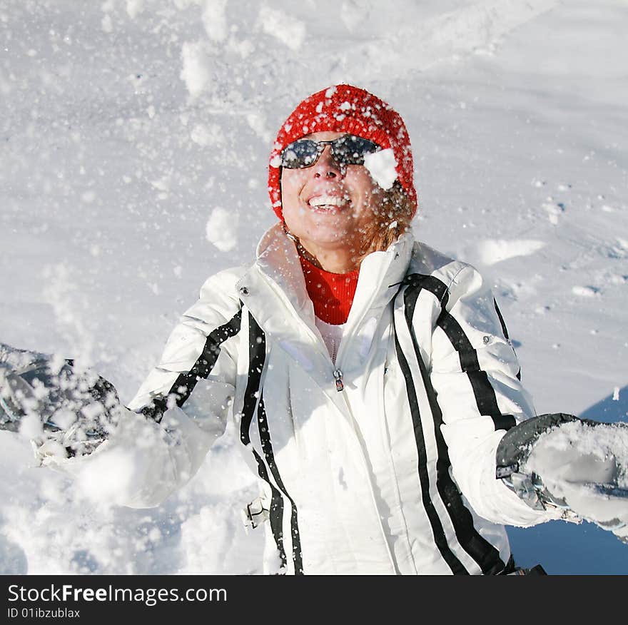 Happy woman plays with snow. Happy woman plays with snow