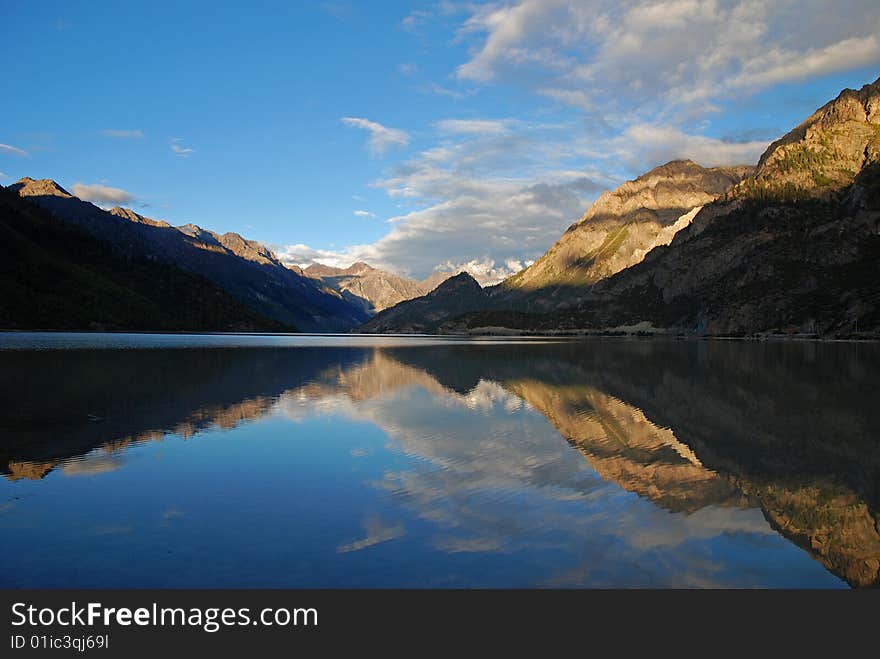 Mountain and sky reflected in the beautiful alpine Lake. Mountain and sky reflected in the beautiful alpine Lake