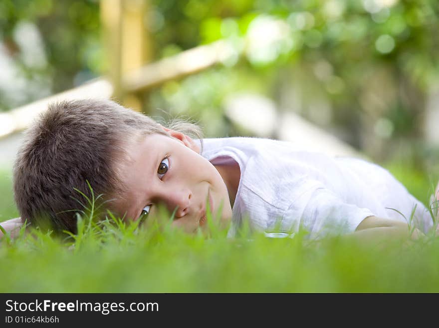 Portrait of little boy having good time in summer environment. Portrait of little boy having good time in summer environment