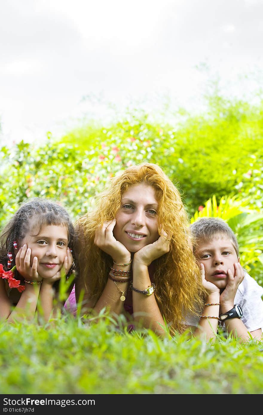 Portrait of little kids with mama having good time in summer environment. Portrait of little kids with mama having good time in summer environment