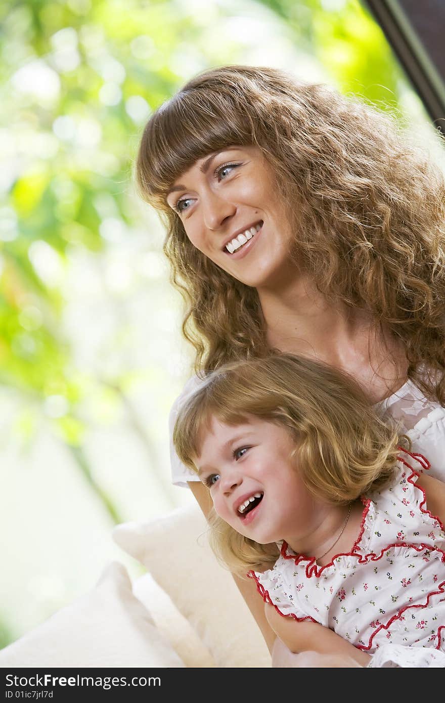 Portrait of happy mother with daughter  having good time in summer environment. Portrait of happy mother with daughter  having good time in summer environment