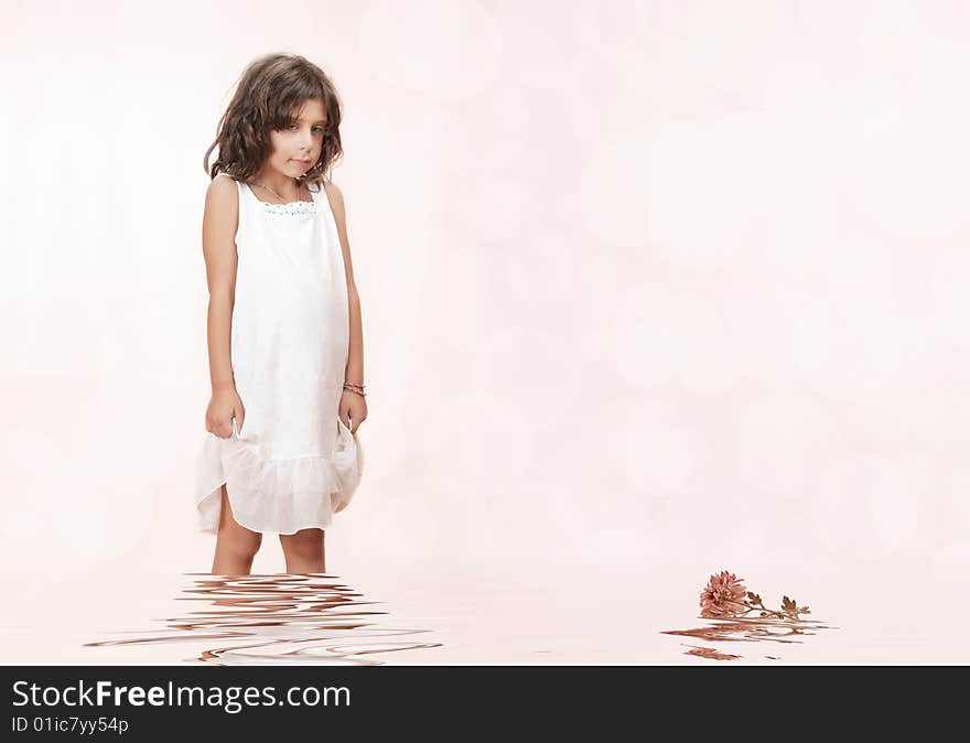 Studio portrait of  nice little girl getting through the water. Studio portrait of  nice little girl getting through the water