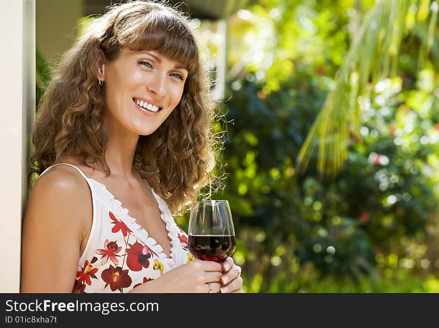 Portrait of young attractive woman having good time in tropic environment. Portrait of young attractive woman having good time in tropic environment