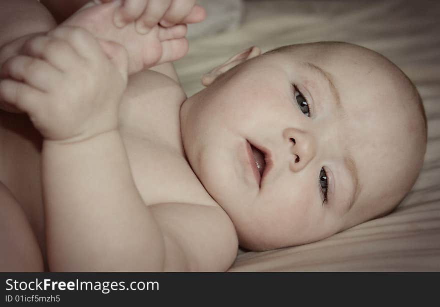 A young Caucasian baby with toes. A young Caucasian baby with toes