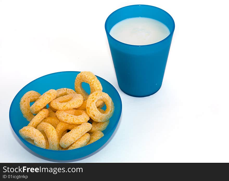 Corn flakes and milk on the white background