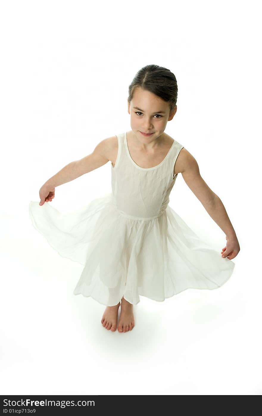 Little girl smiling in camera isolated on white background. Showing an elegant white dress. Little girl smiling in camera isolated on white background. Showing an elegant white dress.