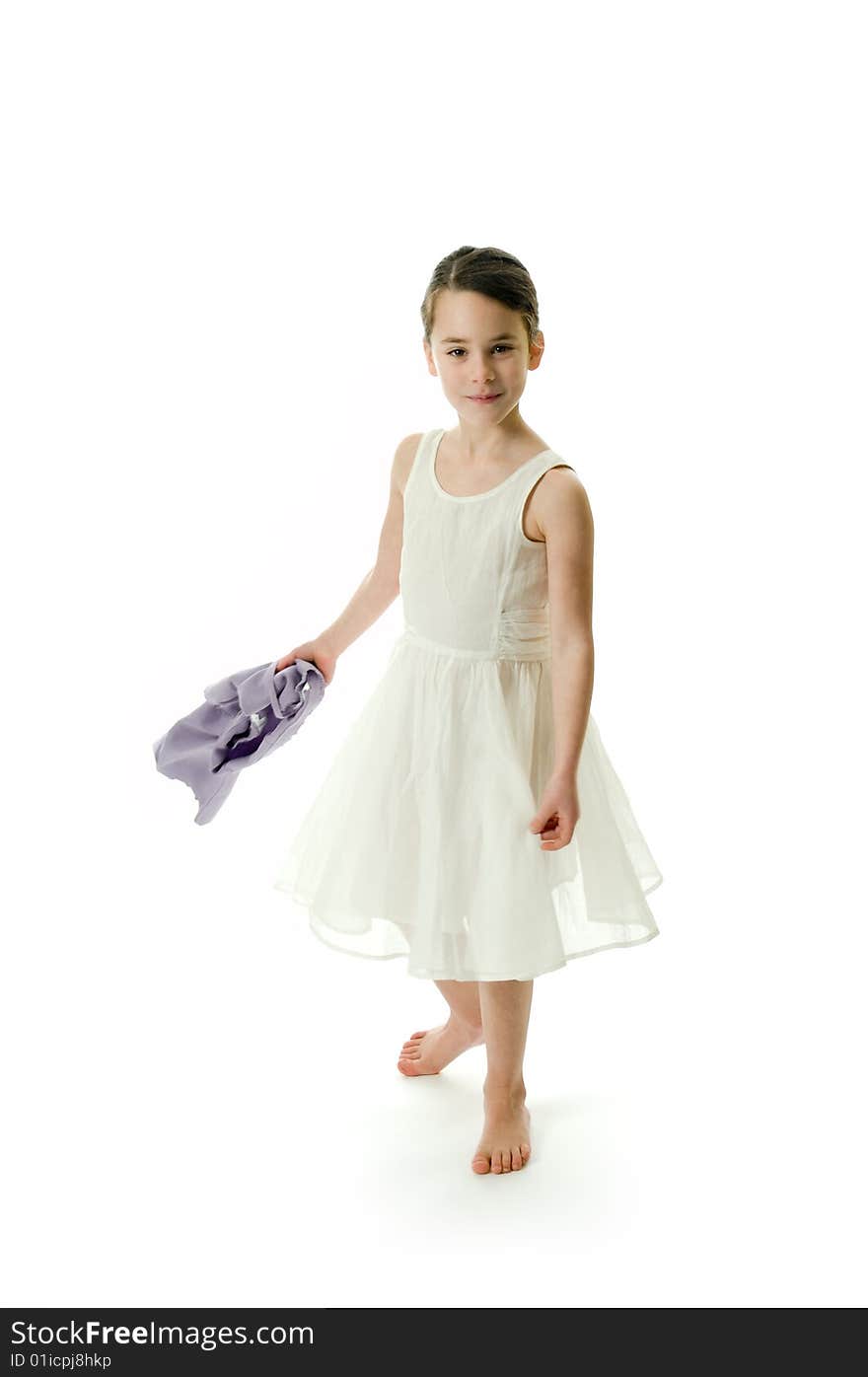 Little girl smiling in camera isolated on white background. Posing in an elegant white dress. Little girl smiling in camera isolated on white background. Posing in an elegant white dress.