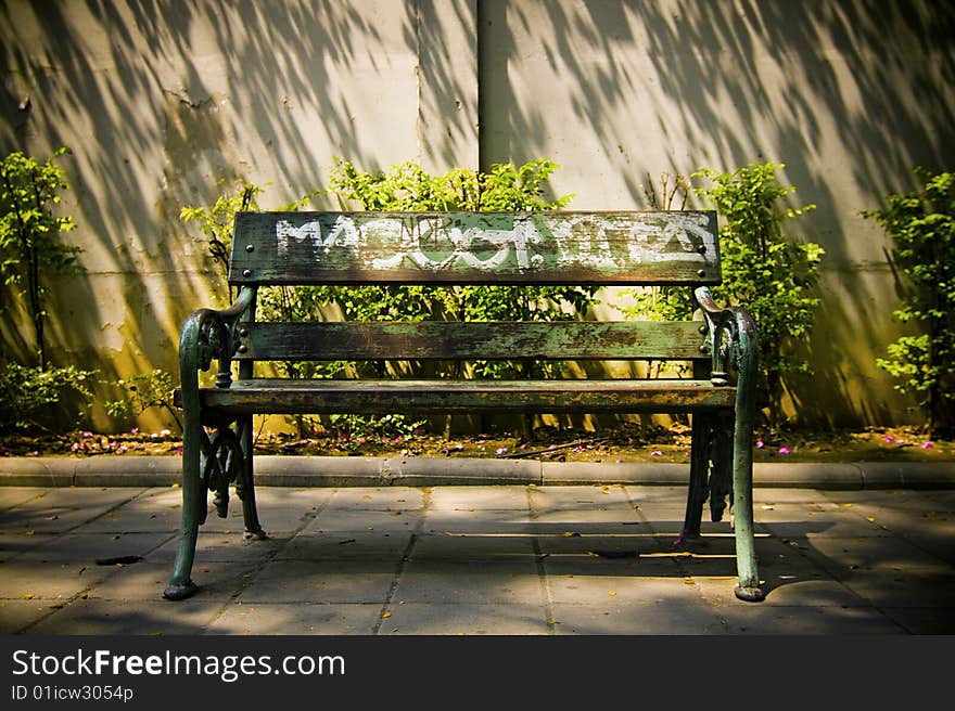 Empty Public Bench In Afternoon Sun