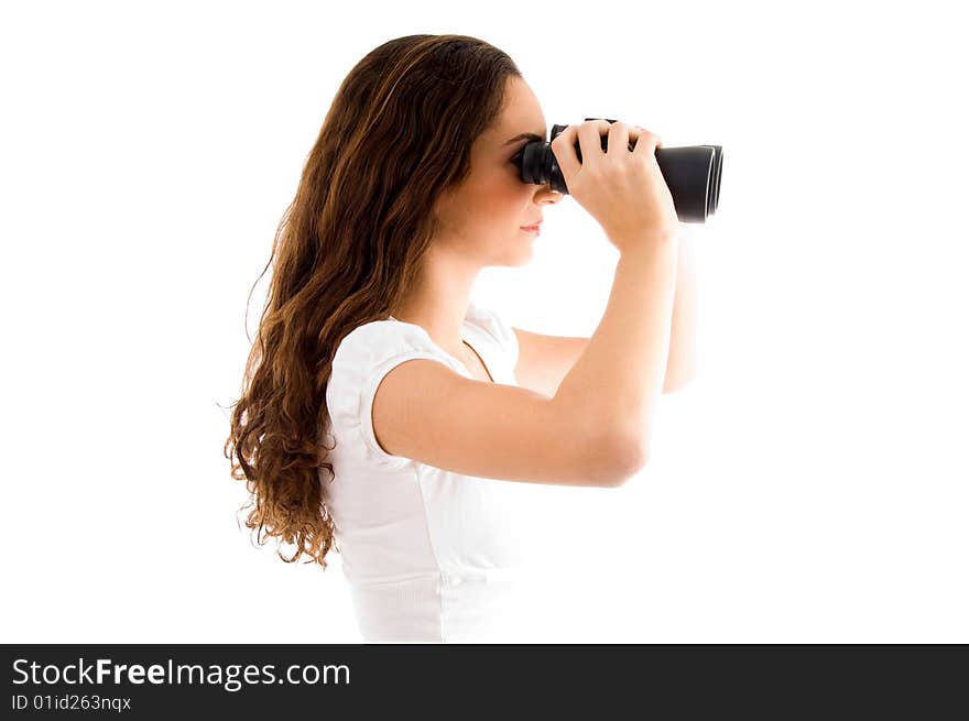 Side pose of female holding binocular with white background