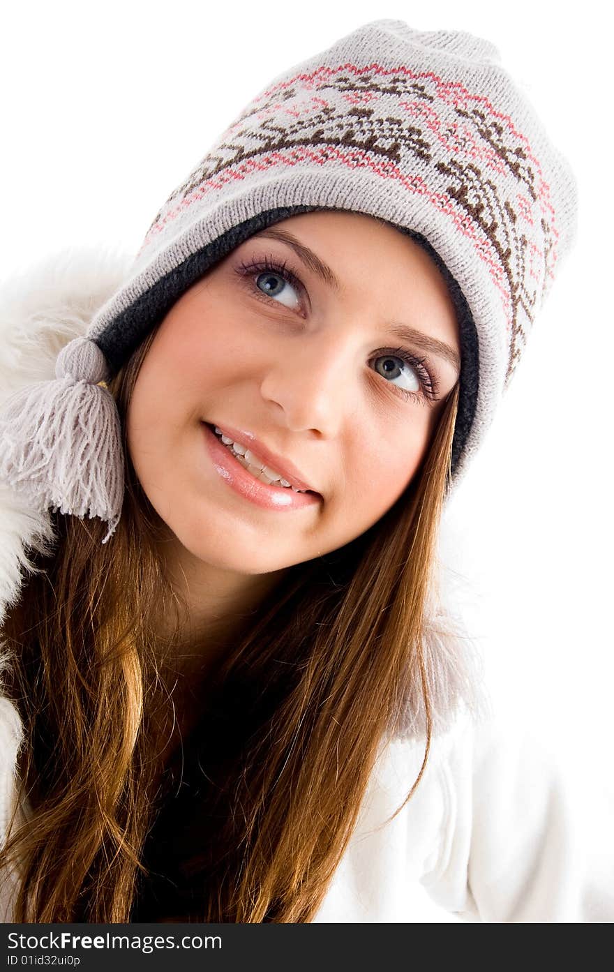 Blonde female with cap and looking upward