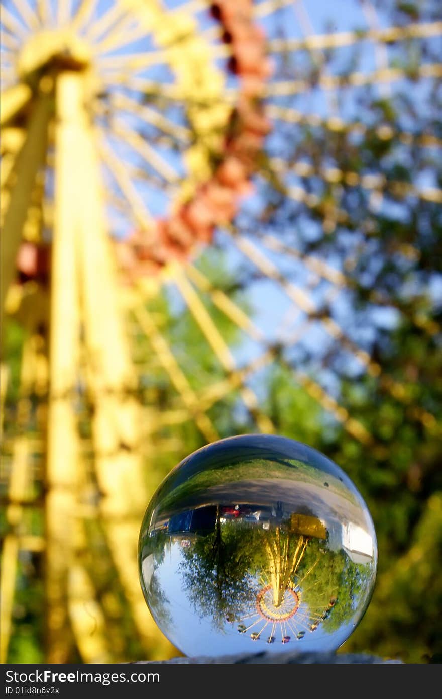 Glass sphere and big wheel. Glass sphere and big wheel