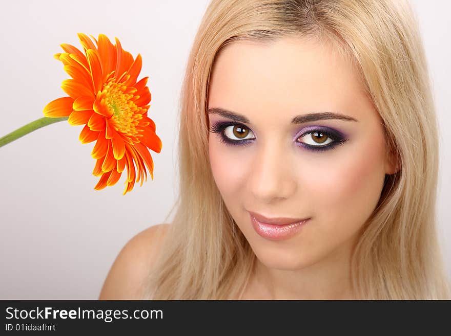 Young fashion woman with gerbera. Young fashion woman with gerbera