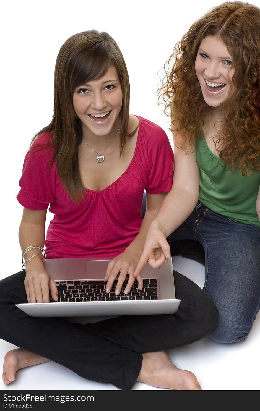 Two teenagers with laptop computer, girls chat on the Internet