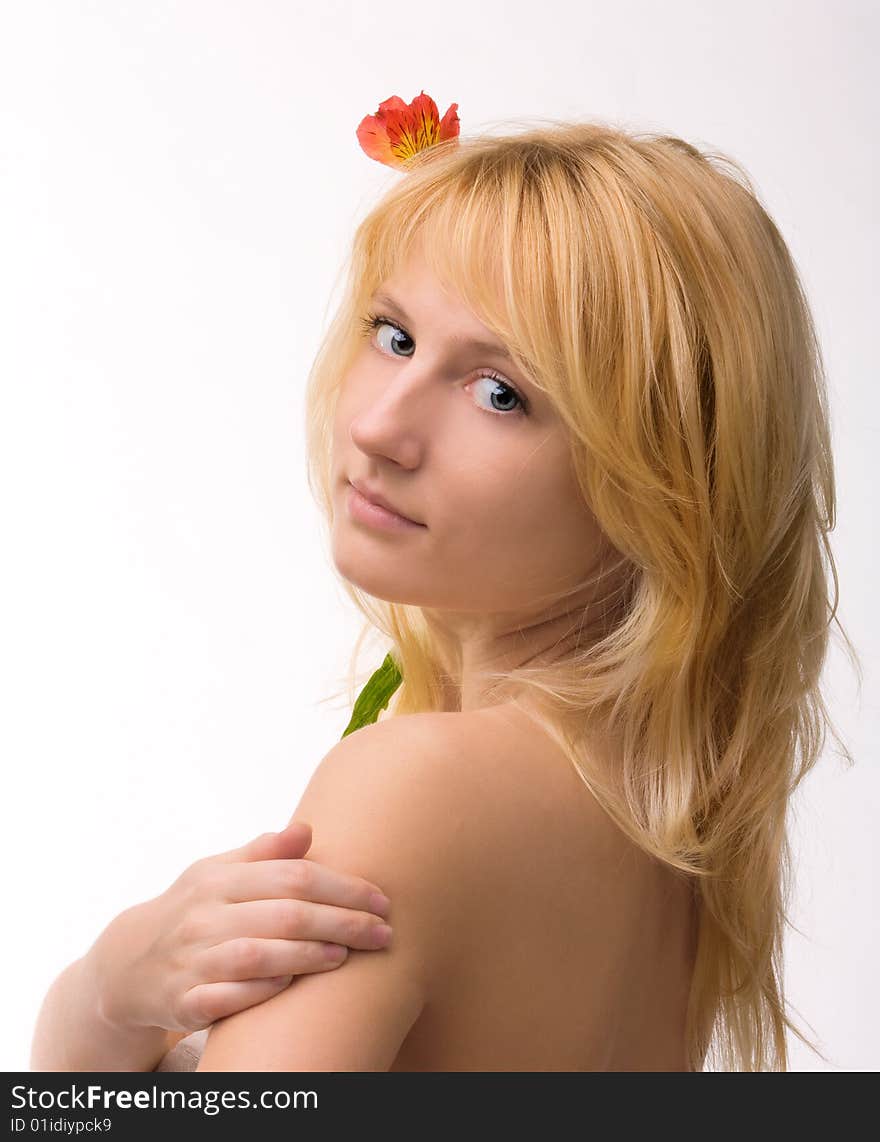 Beautiful girl with flower in hair