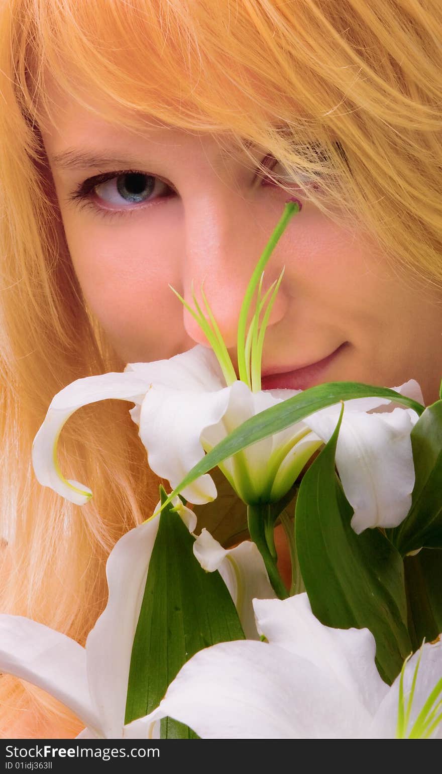 Beautiful young woman a blonde with lily flower. Beautiful young woman a blonde with lily flower