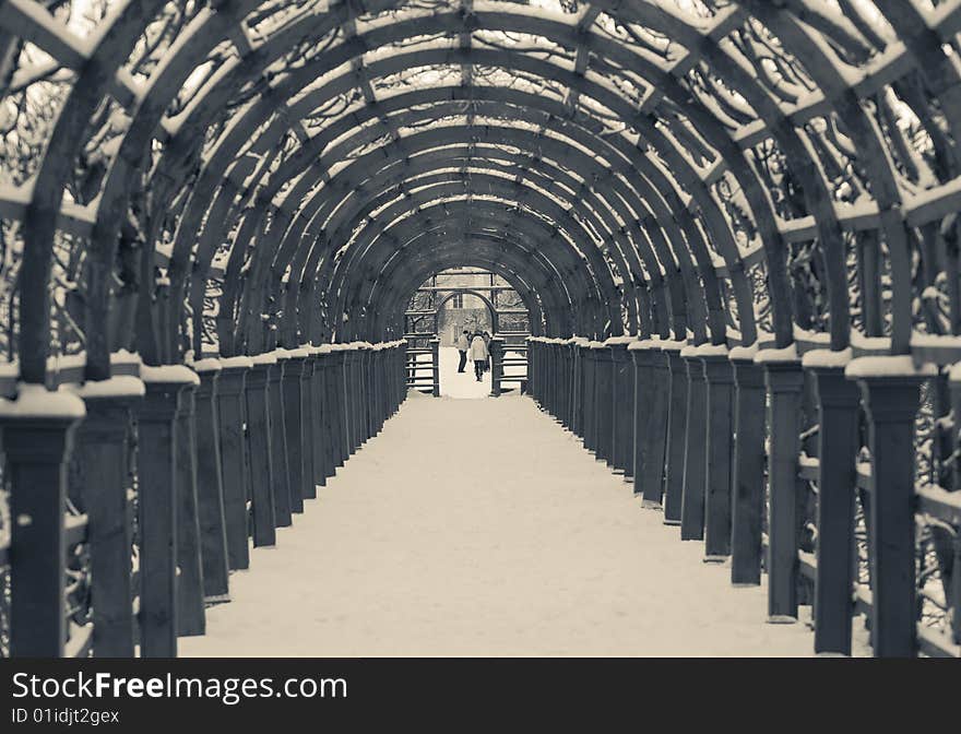 Passage-way from wooden archs as a tunnel, covered snow. Passage-way from wooden archs as a tunnel, covered snow