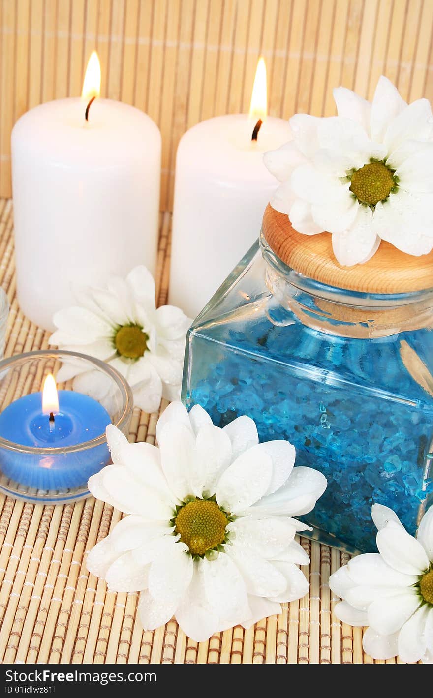 Candles, flowers and sea salt. Candles, flowers and sea salt