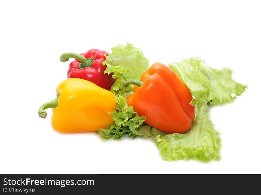 Yellow, red and orange pepper on a white background