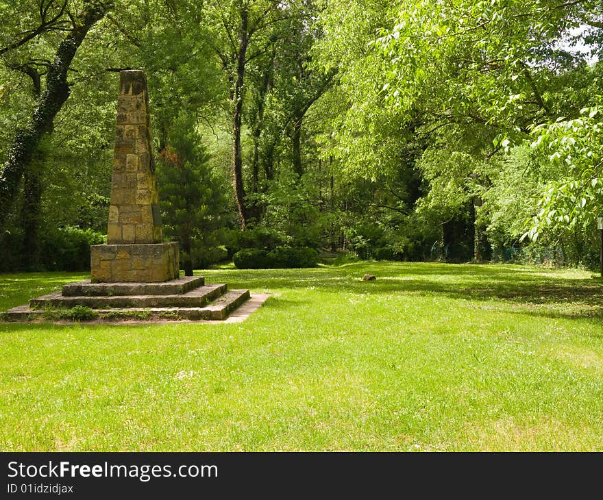 Green grass with little obelisk. Green grass with little obelisk