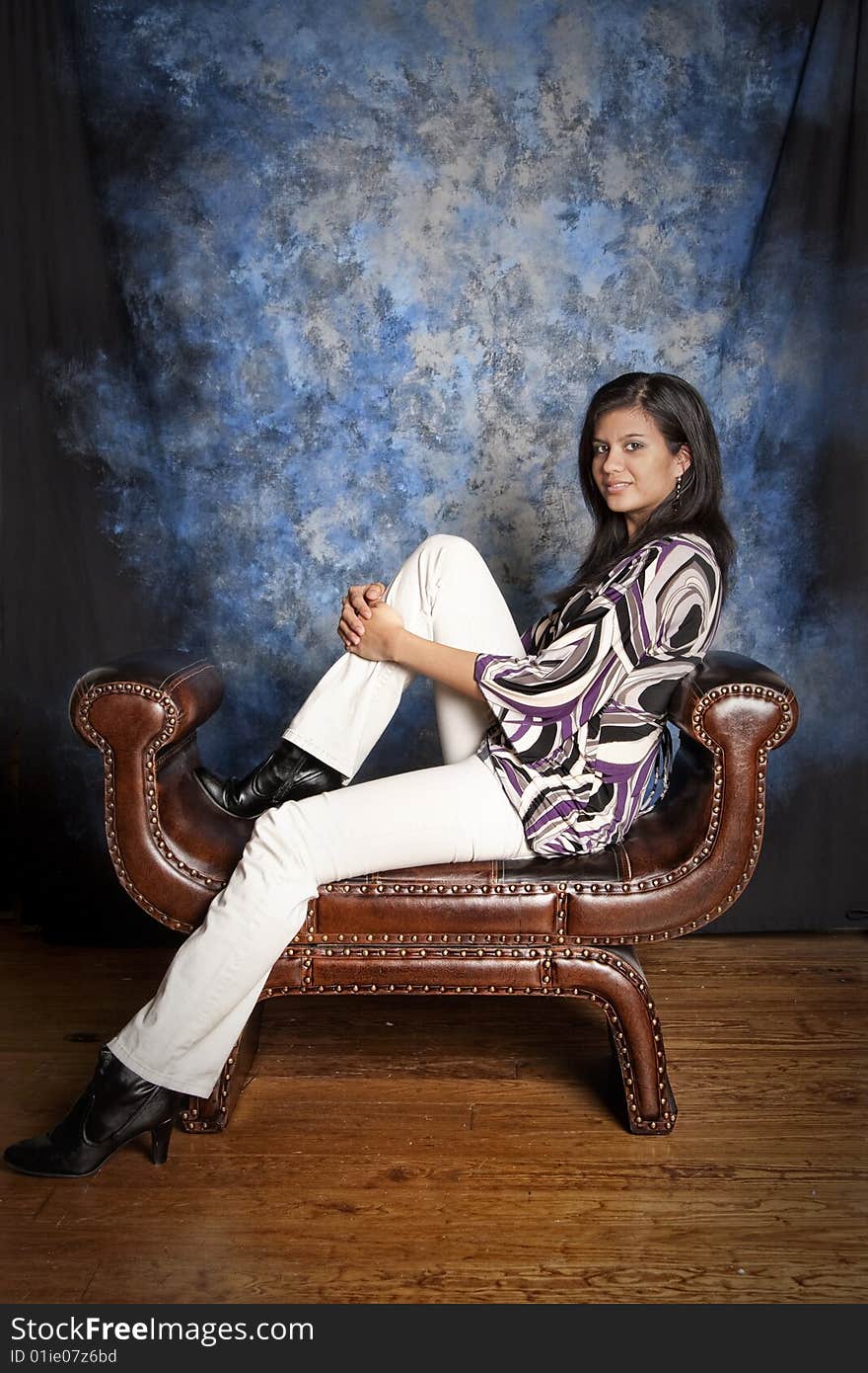 Beautiful interracial woman, full body portrait seated. Beautiful interracial woman, full body portrait seated