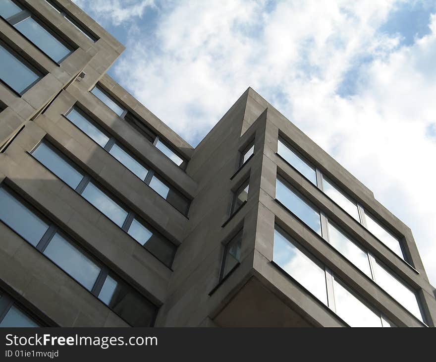 Modern concrete building and cloudy sky