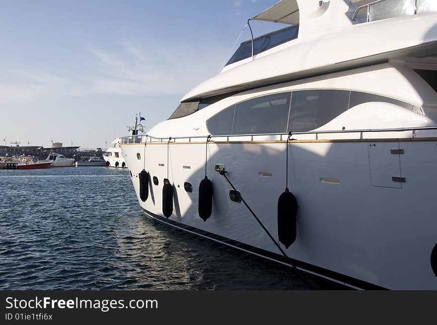 Side view of a majestic, luxurious yacht in Dubai Marina, during boat show. Side view of a majestic, luxurious yacht in Dubai Marina, during boat show.