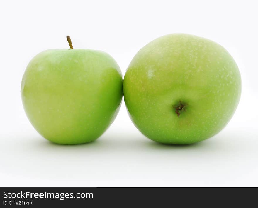 Two juicy green apples on a white background. Two juicy green apples on a white background