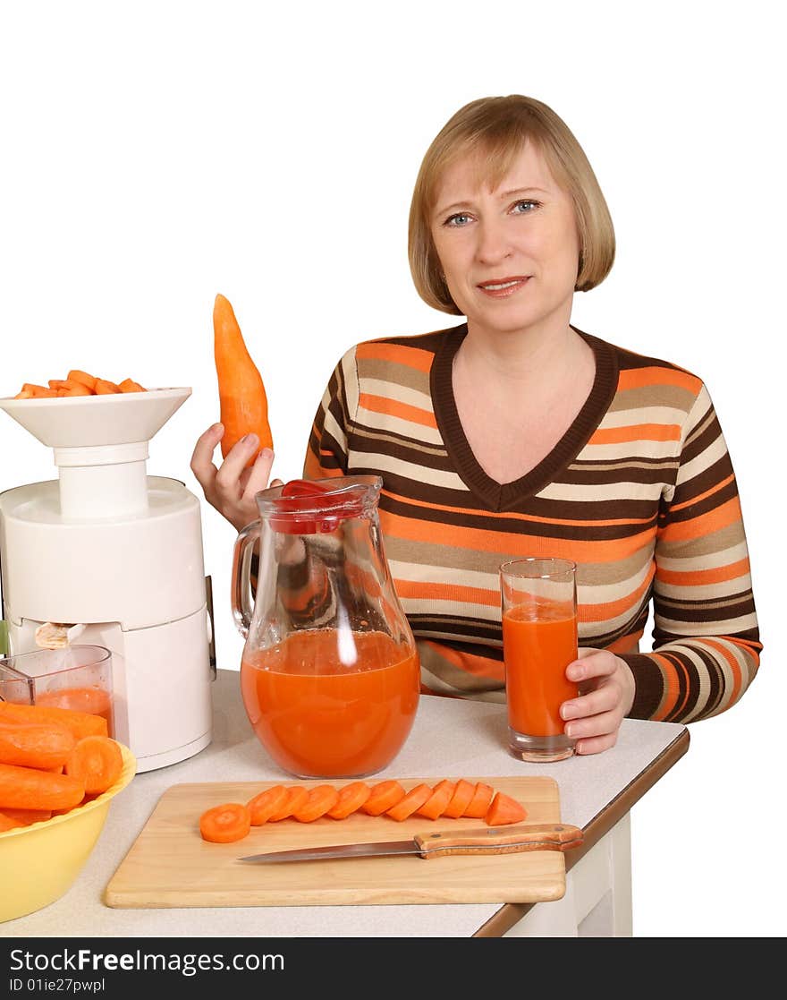 The woman has prepared for juice from carrots. The woman has prepared for juice from carrots