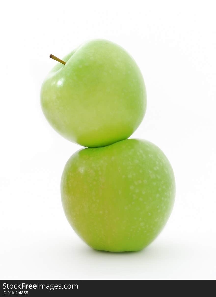 Two juicy green apples on a white background. Two juicy green apples on a white background