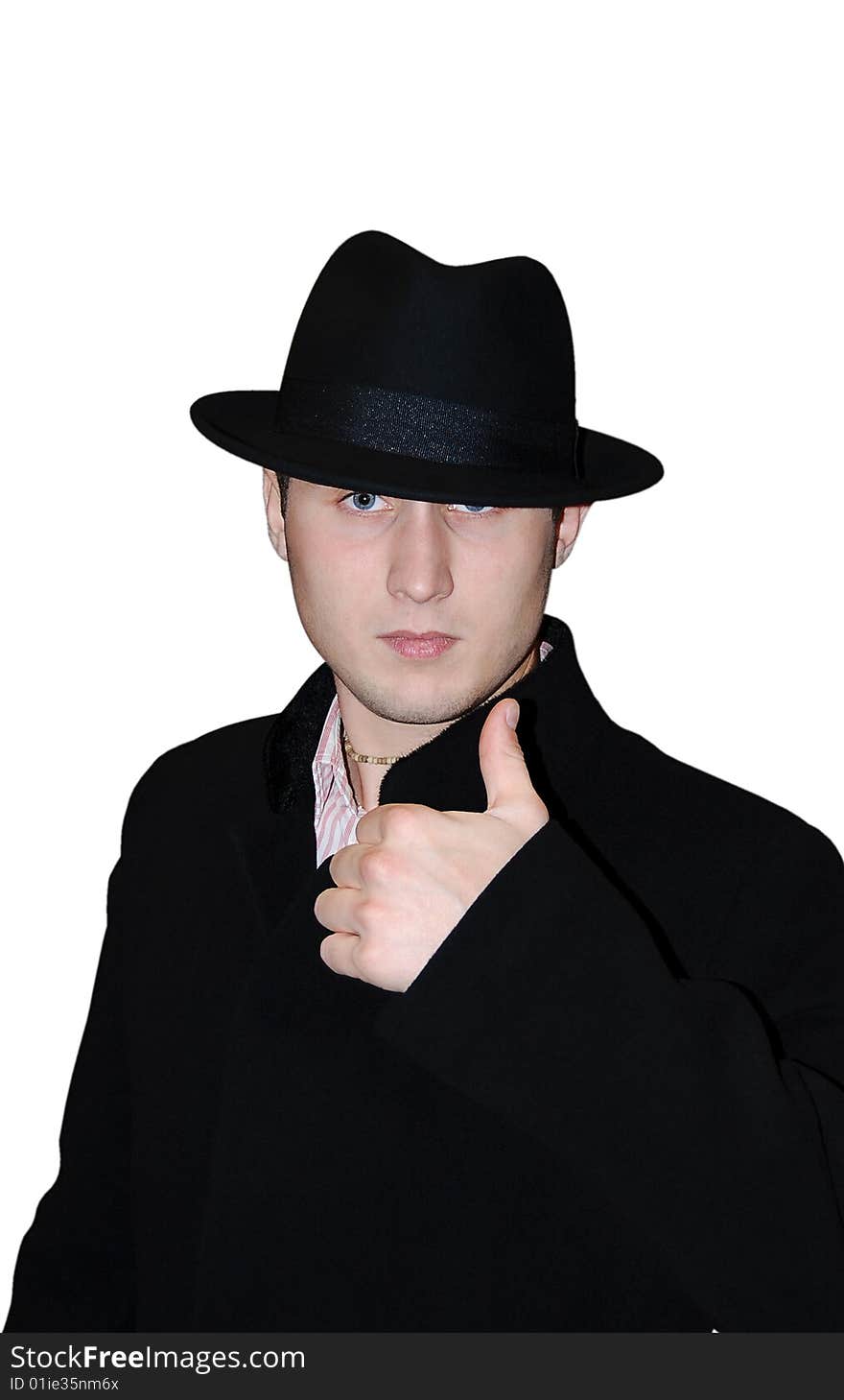 The gentleman in a hat and in a coat on a white background