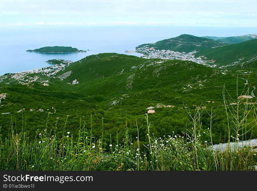 Bird-eye view on coastline and town in highlands