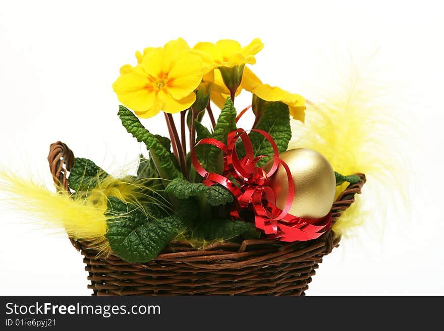 Golden egg with spring yellow flower for easter background. Golden egg with spring yellow flower for easter background.