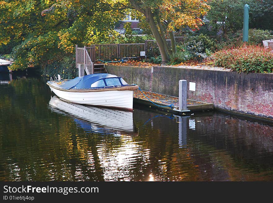 Personal boat next to house in Amsterdam. Personal boat next to house in Amsterdam