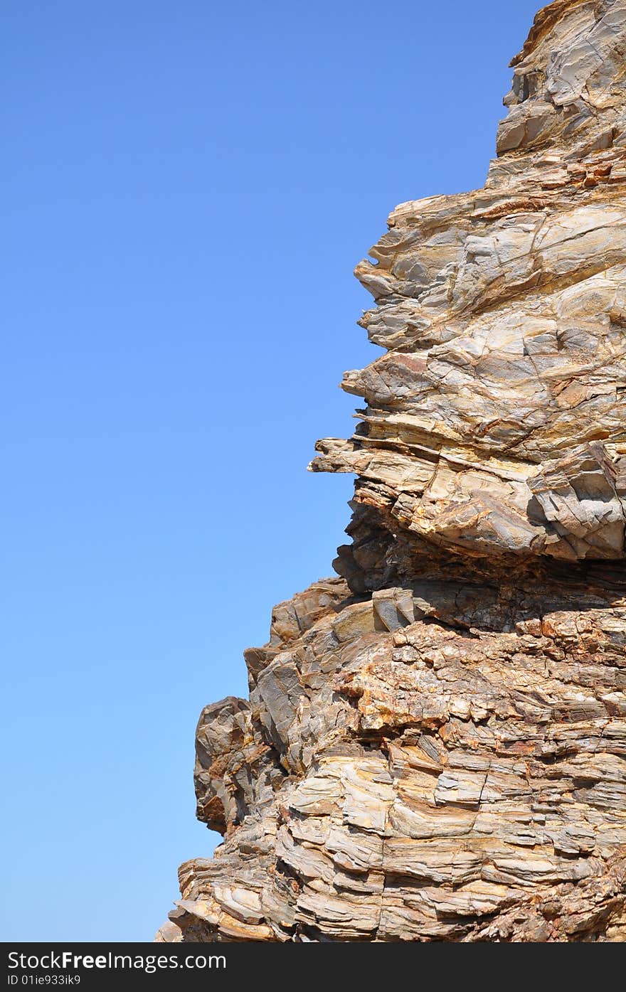 Beach rock contrasting the blue sky. Beach rock contrasting the blue sky